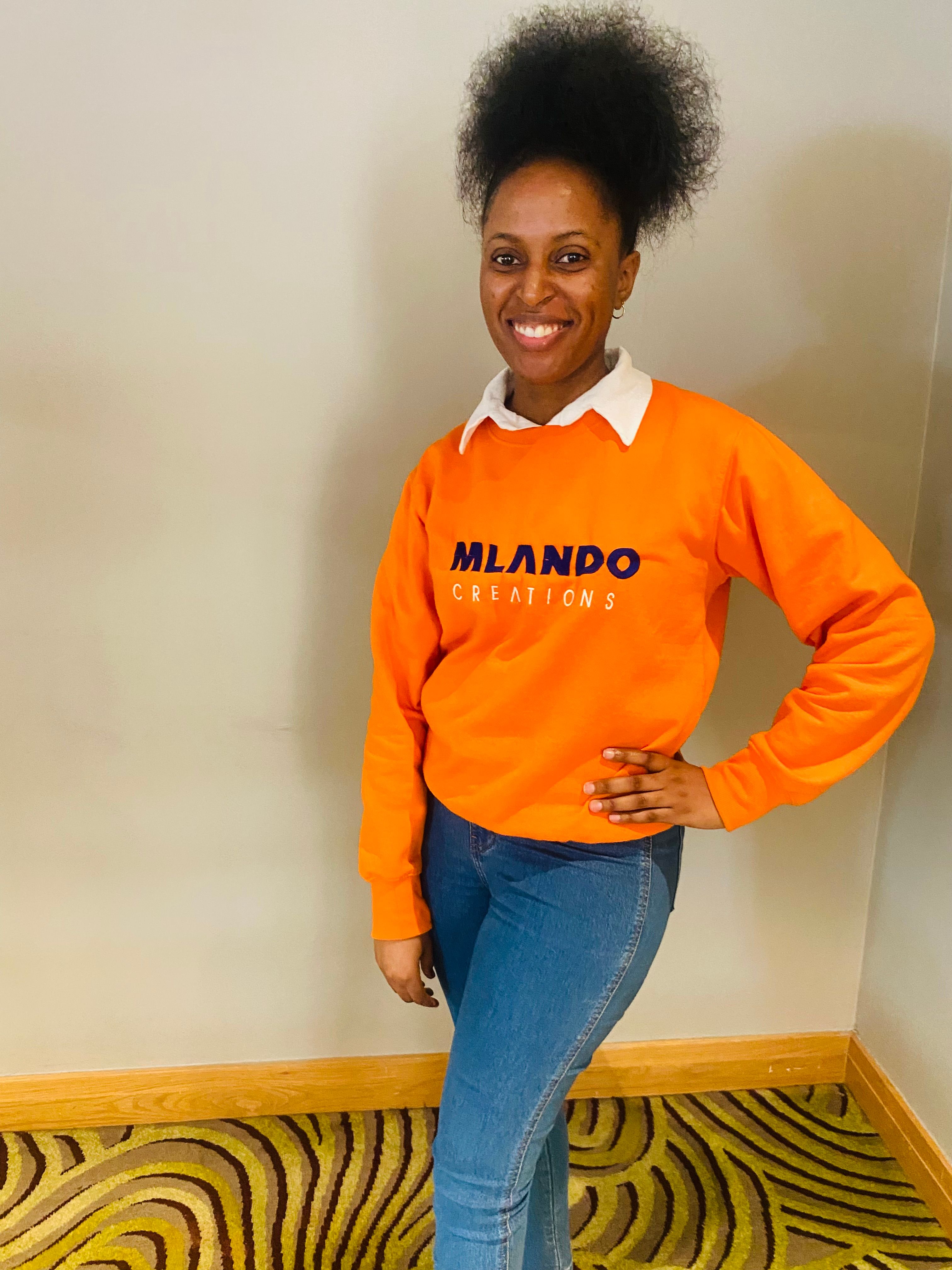 African Lady in a sweater posing for a photo