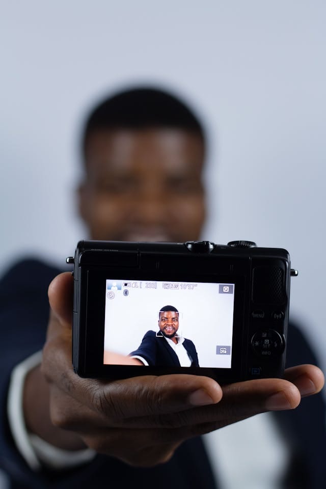 Content Creator Taking a Selfie Shot with a Digital Camera
